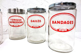 5 Vintage Glass Pharmacy Medical Supplies Jars by Merco, Bandages, Gauze, Cotton